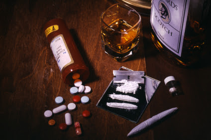 Various forms of drugs and alcohol on a table